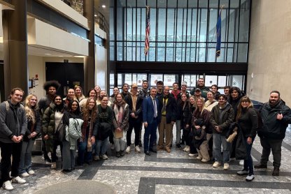 A photo of a group of architecture students and faculty at the State Capitol